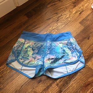 three pairs of size 14 ivivva/athleta girl shorts